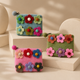 Seis estuches con cremallera de fieltro con flores (3 surtidos)