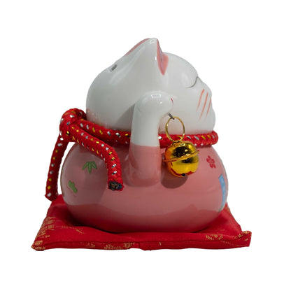 Tirelire en céramique en forme de chat porte-bonheur - rose sur coussin