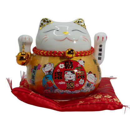 Maneki Neko en céramique avec bras mobile - Doré sur coussin