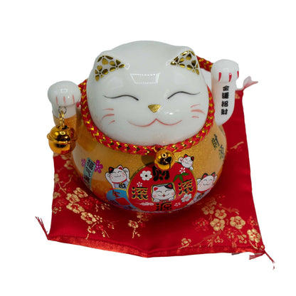 Maneki Neko en céramique avec bras mobile - Doré sur coussin
