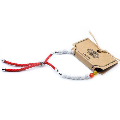 Pulsera de hilo rojo con Khaulita blanca y Chakras